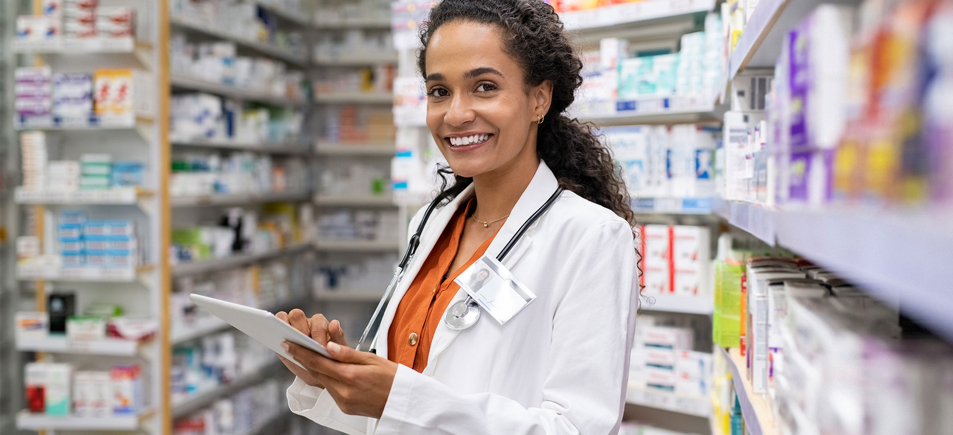 smiling pharmacist in her shop