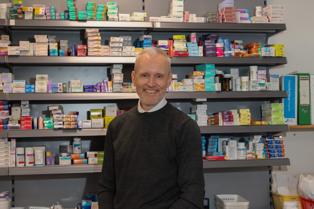 Scott Hutchinson in a pharmacy